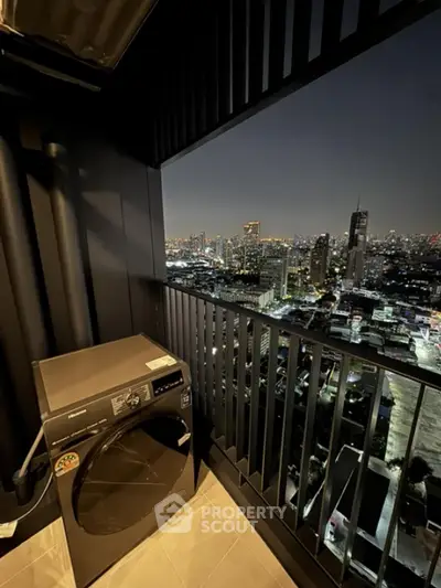 Stunning high-rise balcony with city skyline view and modern washing machine.