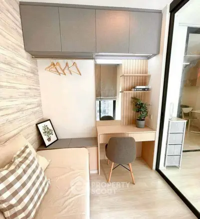 Modern study nook with desk, chair, and storage in cozy apartment.