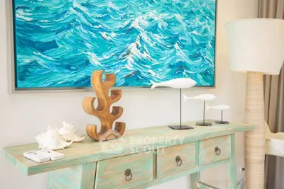 Stylish coastal-themed interior with ocean artwork and decorative elements.