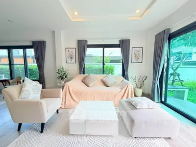 Bright and airy living room with modern decor and garden view