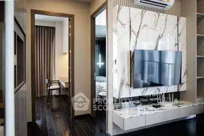 Modern living room with marble TV wall and sleek dark flooring