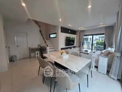 Spacious modern living room with elegant dining area and stylish decor