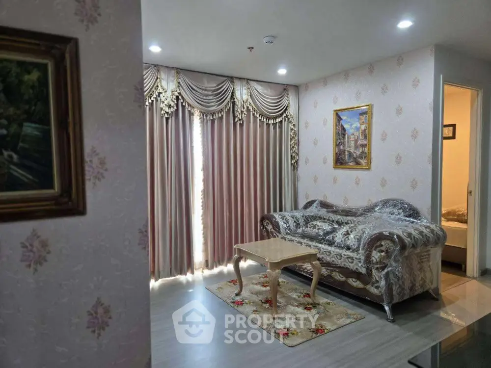 Elegant living room with ornate curtains and classic sofa set in a cozy apartment.