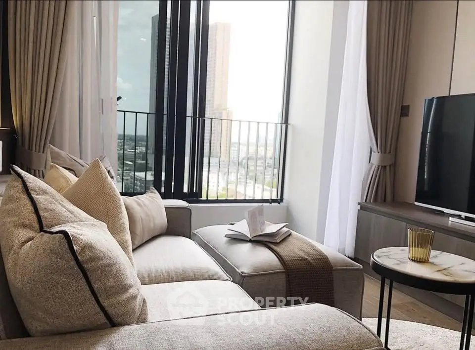 Modern living room with cozy sofa and city view through large windows, perfect for urban living.