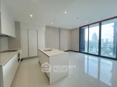 Luxurious modern kitchen with island and stunning city view