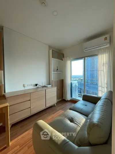 Cozy living room with modern furniture and city view from balcony