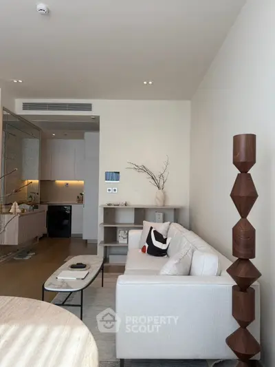 Modern living room with stylish decor and open kitchen layout