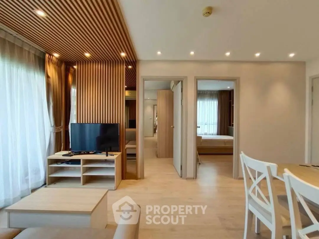 Modern living room with wooden accents and natural light