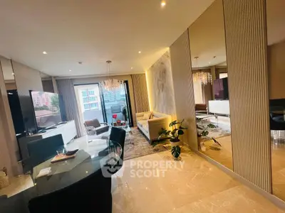 Luxurious modern living room with elegant decor and spacious layout, featuring a large TV and stylish furniture.