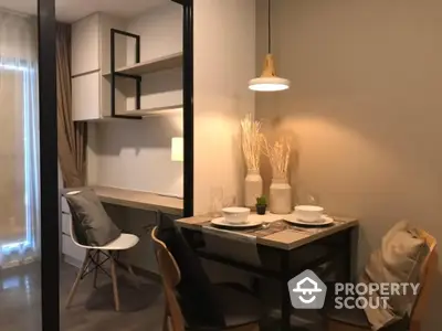 Modern dining area with stylish decor and cozy seating in a contemporary apartment.