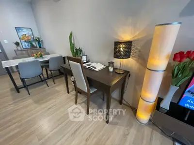 Modern living room with stylish furniture and elegant lighting, perfect for a cozy home office setup.