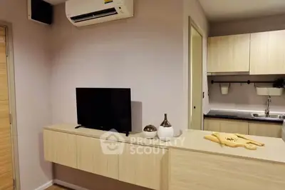 Modern living room with sleek TV unit and open kitchen layout
