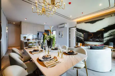 Luxurious open-plan living and dining area with elegant decor and modern furnishings.