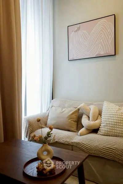 Cozy living room with stylish decor and natural light