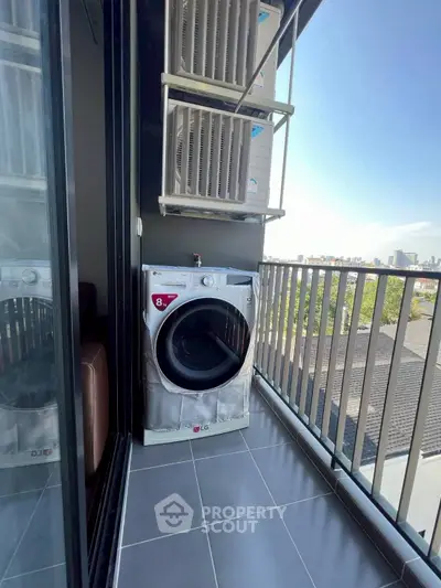 Modern balcony with washing machine and city view, perfect for urban living.