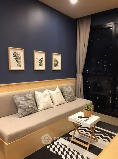 Cozy modern living room with stylish decor and city view.