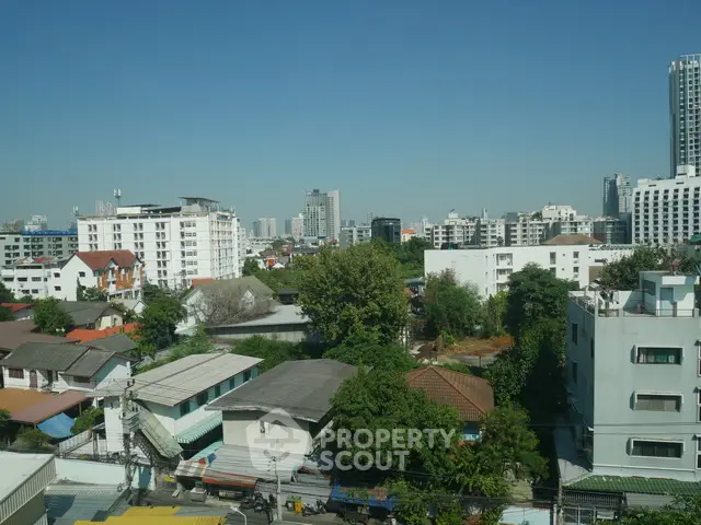 Stunning cityscape view showcasing diverse architecture and lush greenery, perfect for urban living enthusiasts.
