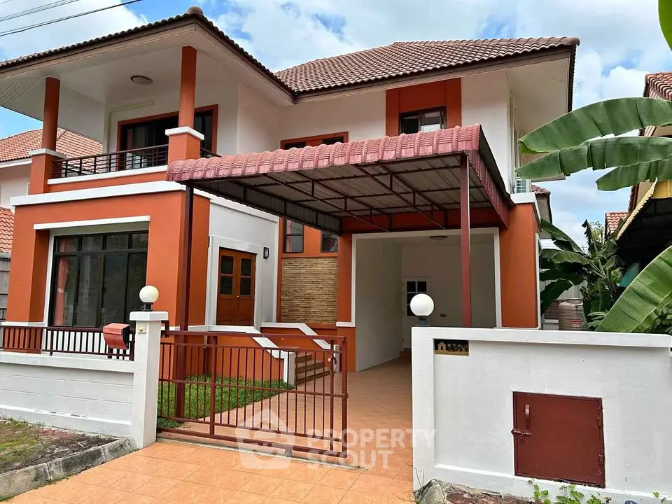 Charming two-story house with tiled roof and spacious driveway in a serene neighborhood.