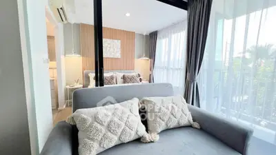 Modern living room with cozy sofa and large windows in a stylish apartment