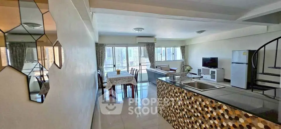 Spacious open-plan living room with modern kitchen and city view, perfect for urban living.
