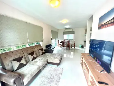 Spacious living room with modern decor and natural light