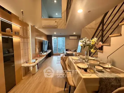 Modern duplex living room with elegant dining area and stylish decor