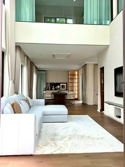 Luxurious modern living room with high ceilings and elegant decor