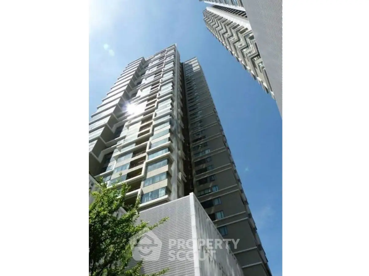 Stunning high-rise building with modern architecture and expansive glass windows.