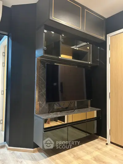 Modern living room with sleek TV unit and stylish cabinetry