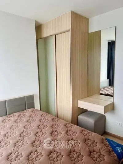 Cozy bedroom with stylish built-in wardrobe and elegant decor