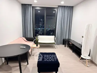 Modern living room with city view, stylish furniture, and elegant decor.