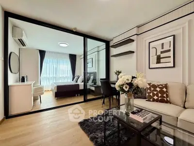 Modern living room with glass partition and stylish decor