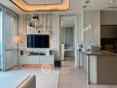 Luxurious modern living room with open kitchen, featuring elegant decor and large windows for natural light.