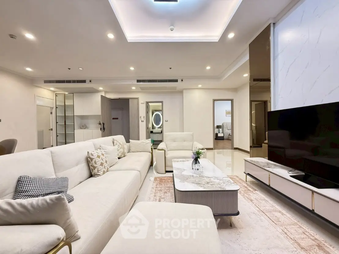 Luxurious modern living room with elegant white sofas and sleek decor