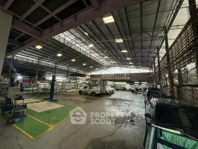 Spacious industrial warehouse with high ceilings and ample parking space