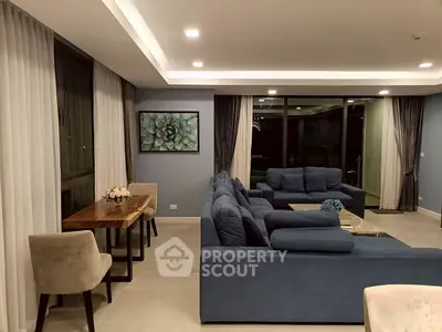 Spacious modern living room with blue sofas and elegant decor