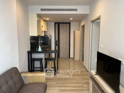 Modern apartment interior with open kitchen and cozy living area