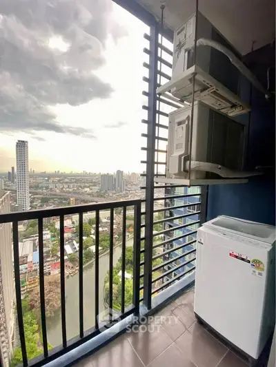 Stunning high-rise balcony with cityscape view and modern appliances.