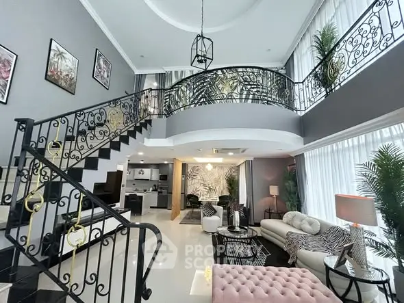 Luxurious modern living room with elegant staircase and high ceilings, perfect for sophisticated living.