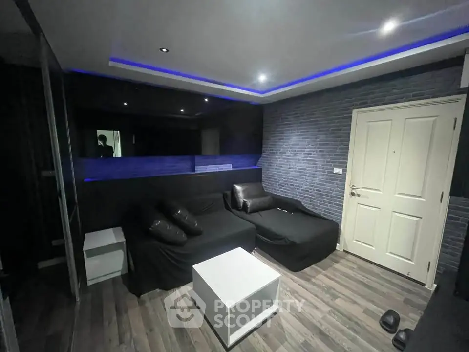 Modern living room with stylish lighting and sleek furniture