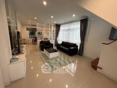 Spacious modern living room with elegant decor and ample natural light