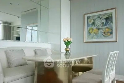 Elegant dining area with modern decor and stylish furniture in a luxurious apartment.