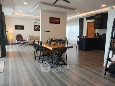 Spacious modern living room with open kitchen and stylish decor