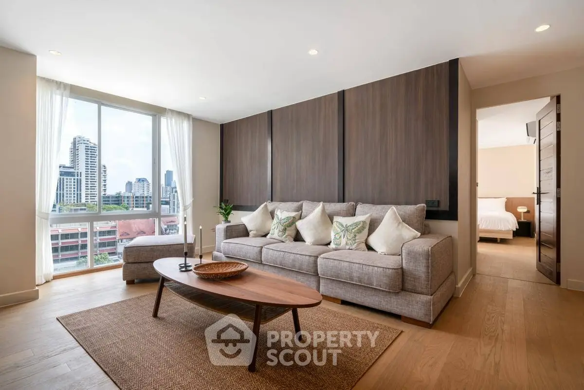 Spacious modern living room with city view and elegant decor