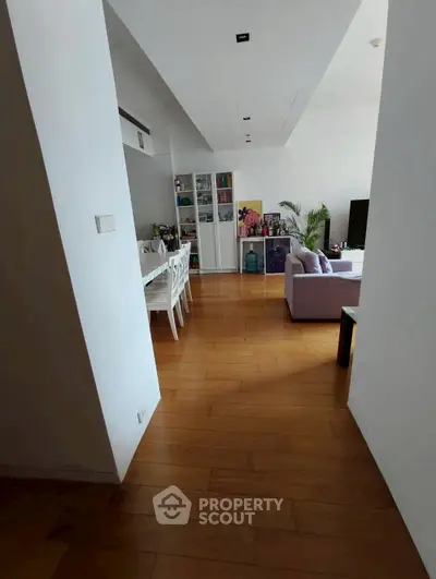 Spacious modern living room with wooden flooring and stylish decor