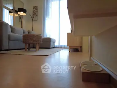 Cozy living room with modern sofa and stylish floor lamp