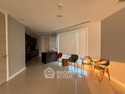 Spacious modern living area with stylish chairs and natural light