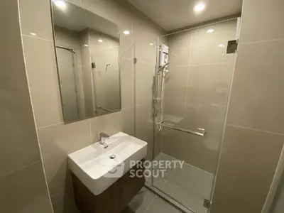 Modern bathroom with sleek design and glass shower enclosure