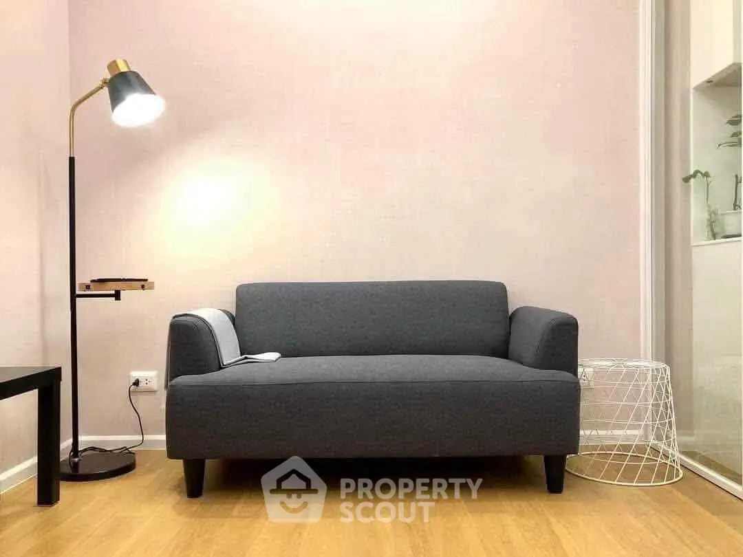 Cozy living room with modern gray sofa and stylish floor lamp