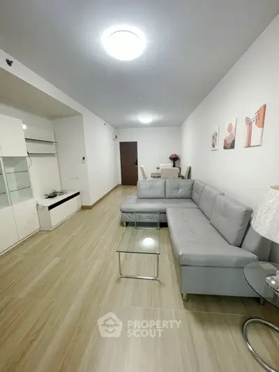 Spacious modern living room with sleek furniture and elegant decor